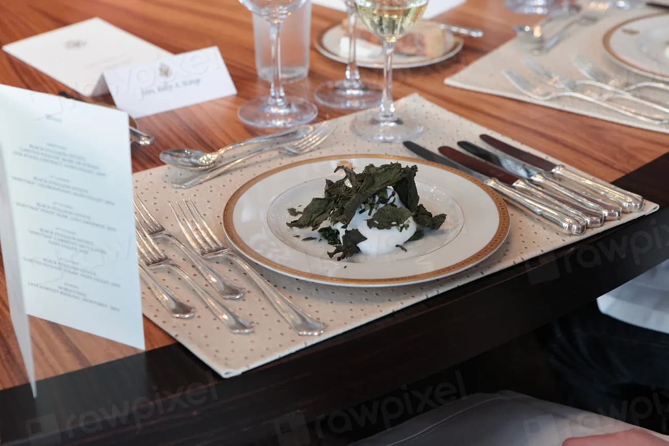 A table laid for dinner, with a handwritten menu card